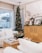 A cozy living room showcasing beautifully arranged home décor items and handmade ornaments.