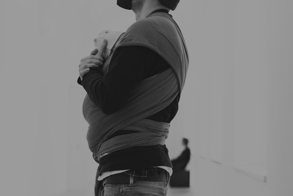 a man standing in a room with his back to the camera