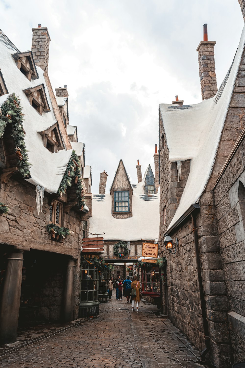 a cobblestone street lined with stone buildings