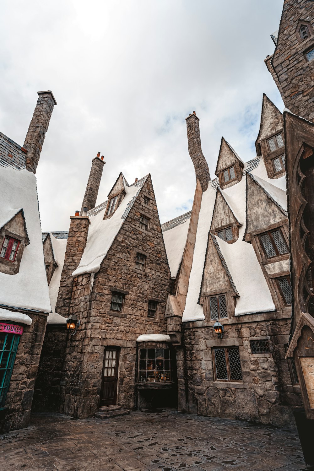 a stone building with a clock on the front of it