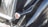 Close-up of a shiny, freshly polished car surface reflecting sunlight.