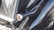 A close-up of a polished car exterior reflecting sunlight, showcasing its glossy finish.