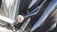 Close-up of a shiny, freshly detailed car exterior reflecting sunlight.