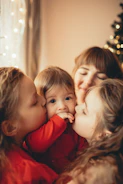 Warm family moment with Katherine and her triplets in a cozy home setting.