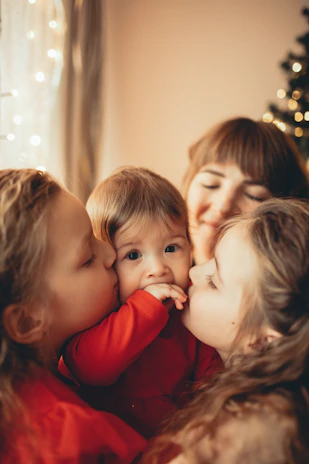The grandmother and children sharing a warm moment in the kitchen.