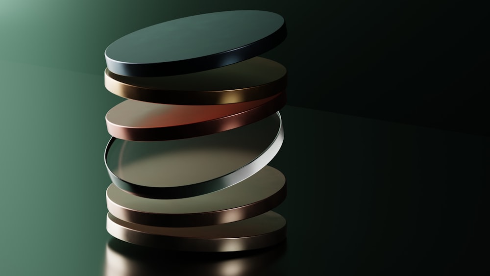 a stack of metal discs sitting on top of a table