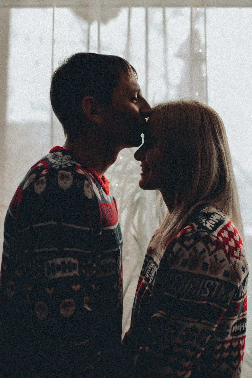 a man and a woman standing next to each other