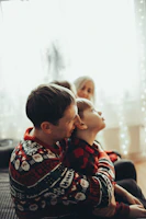A cozy scene of characters sharing a heartfelt moment in a family drama film.