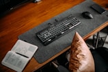 Creative workspace with sketches, notes, and a camera on a wooden desk.