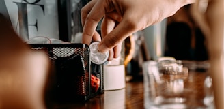Technician carefully installing a sleek coffee vending machine in an office lobby.