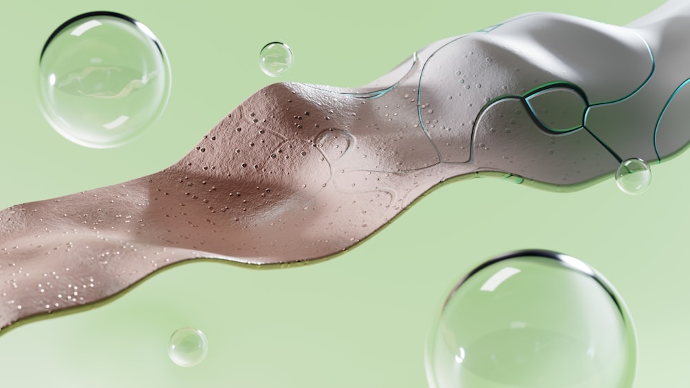 a close up of a toothbrush with water droplets