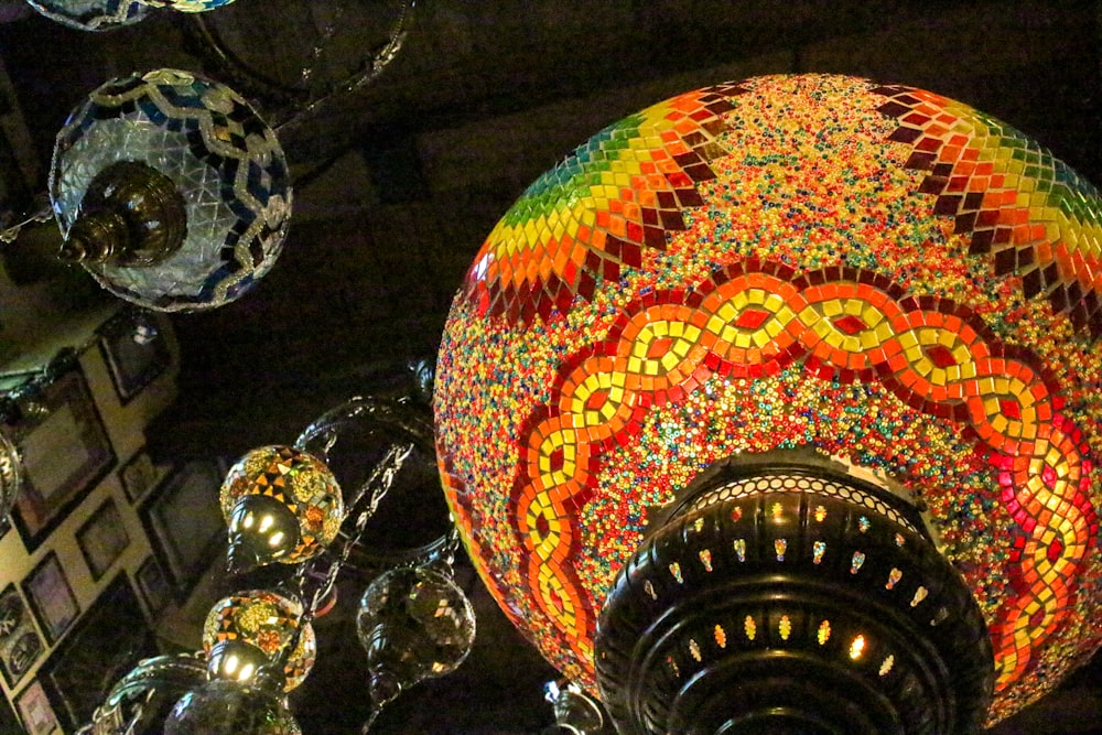 a multicolored light fixture hanging from the ceiling