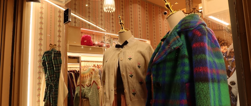 a store display with a variety of clothing on mannequins