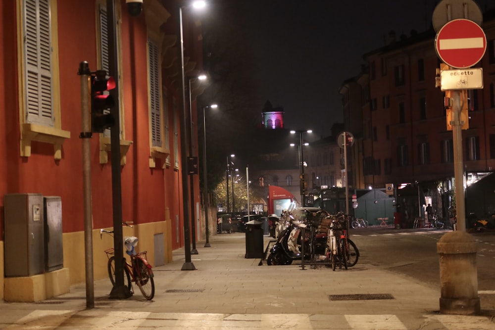 a group of bikes parked on the side of a street