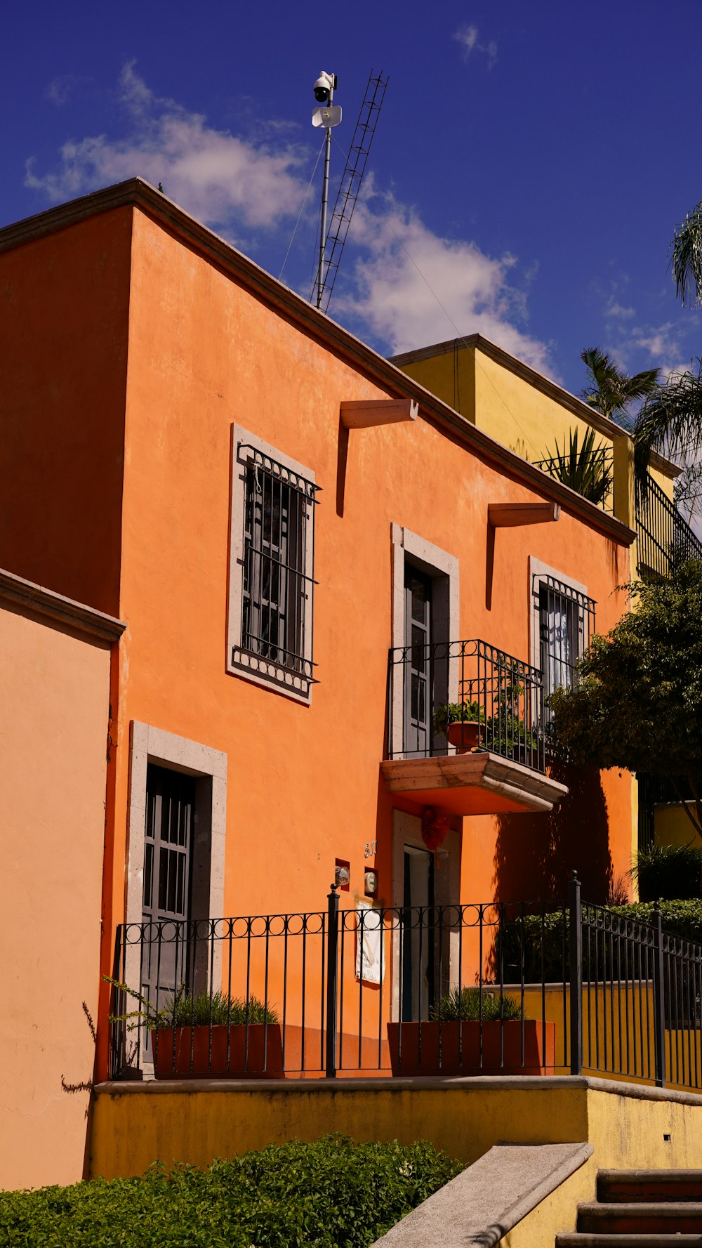 an orange building with balconies and balconies on it