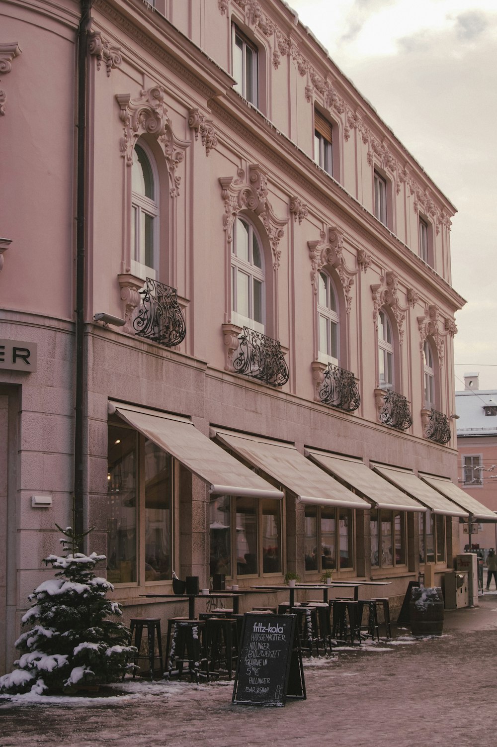 a building that has a bunch of tables outside of it