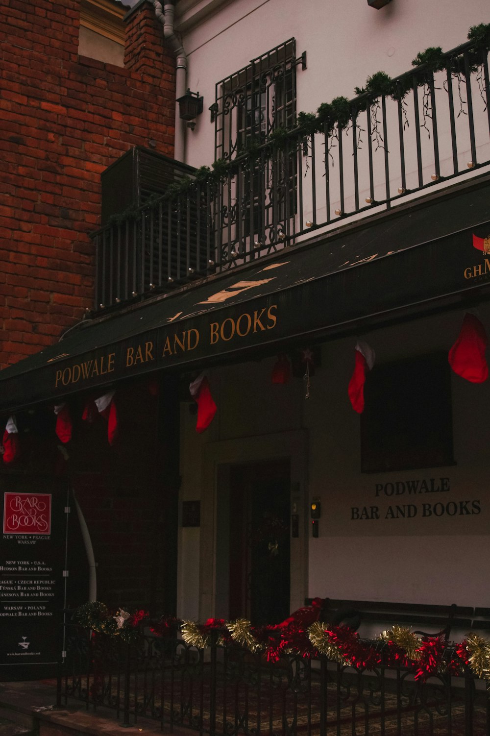 the front of a building with christmas decorations on the outside of it