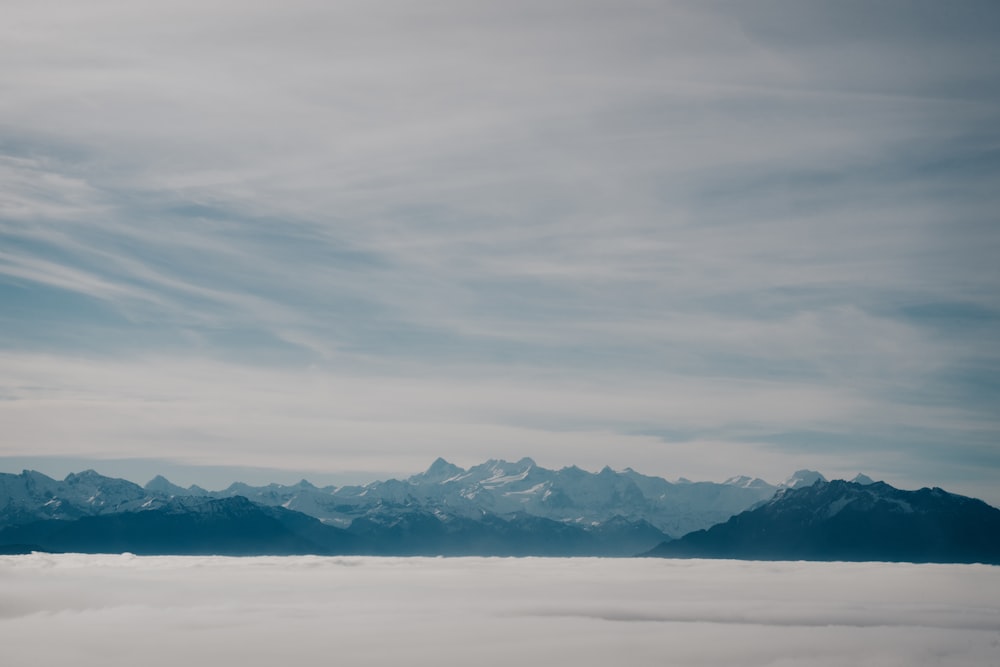 a view of a mountain range from above the clouds