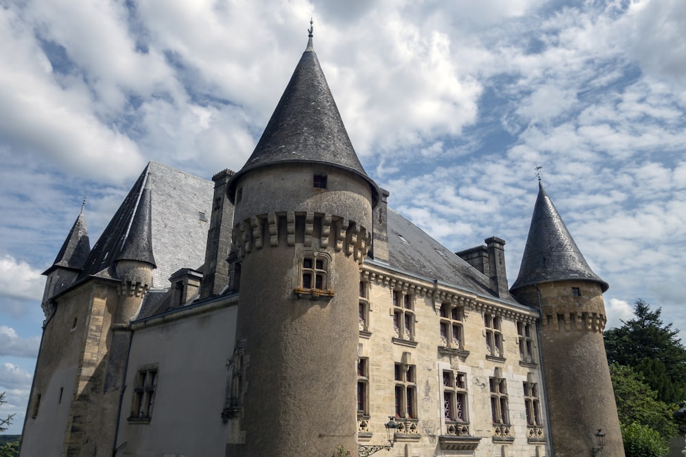 an old castle with turrets and a clock tower