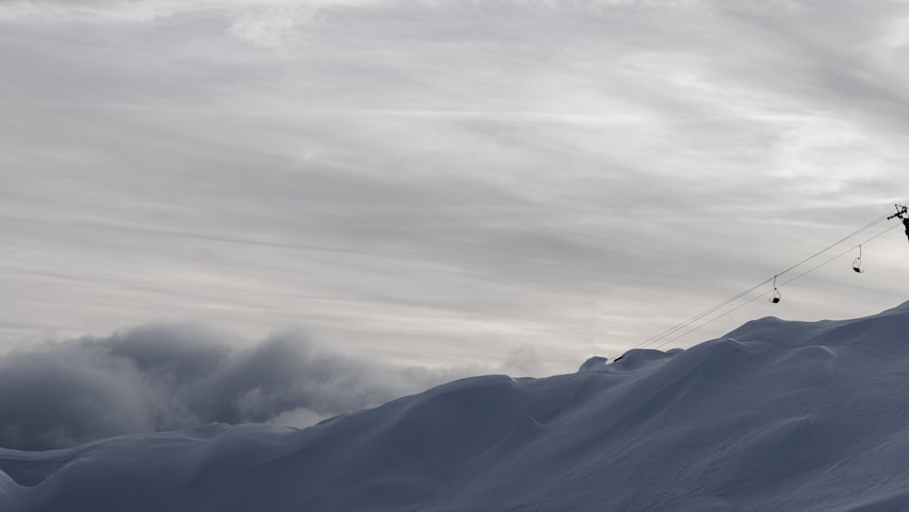 a person on skis is skiing down a snowy hill