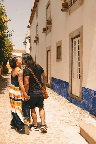 Happy couple exploring colorful streets in Barrancas del Cobre.