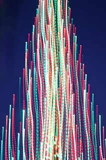 a large christmas tree with lights on top of it