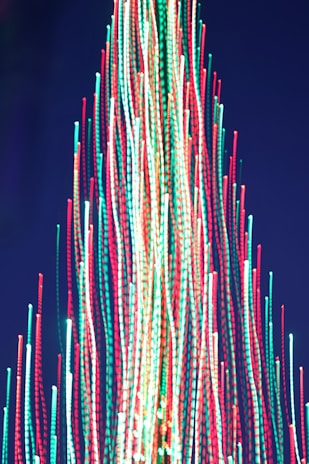 a large christmas tree with lights on top of it