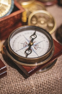 a compass sitting on top of a wooden box
