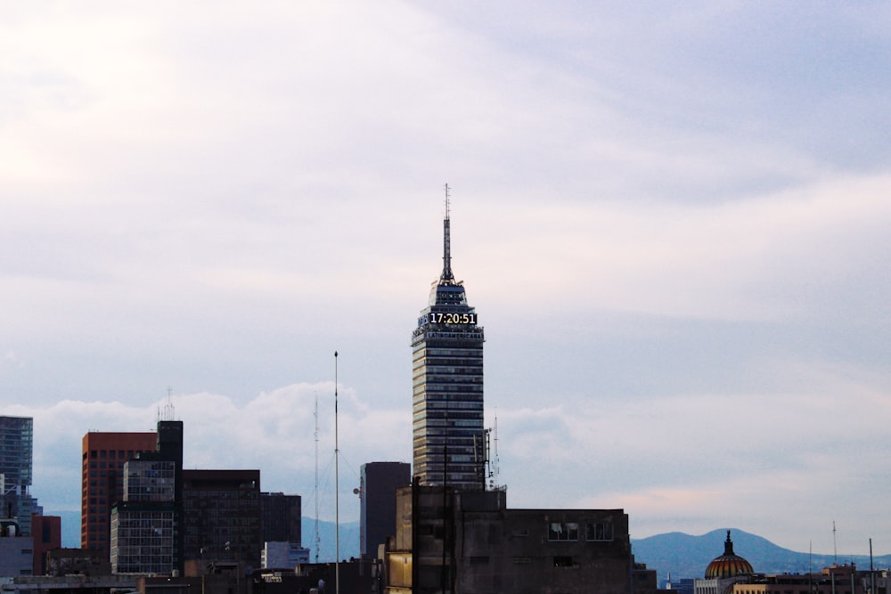 a very tall building with a sky scraper in the background