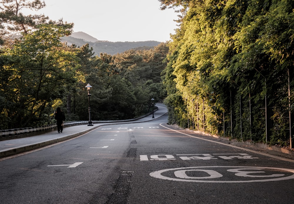 an empty street with a sign on the side of it