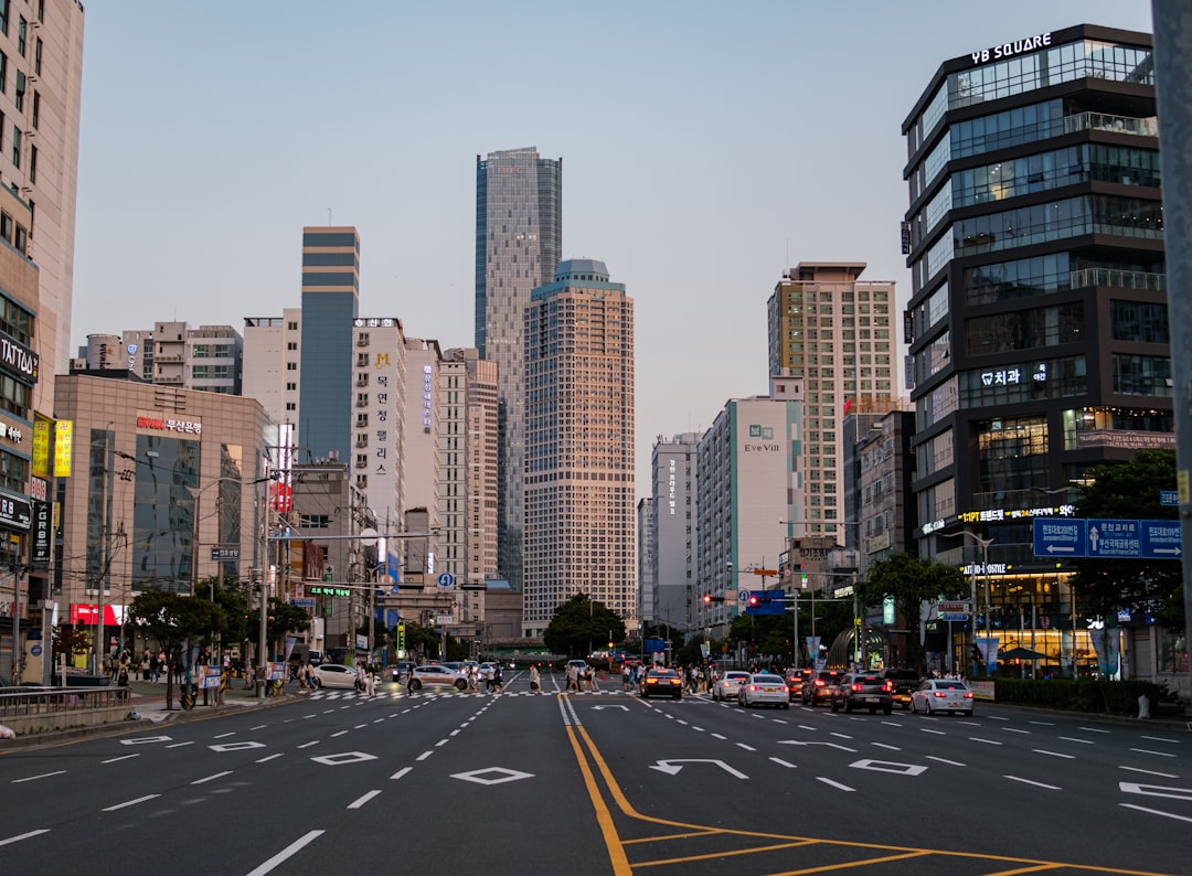 a city street filled with lots of tall buildings, center of busan