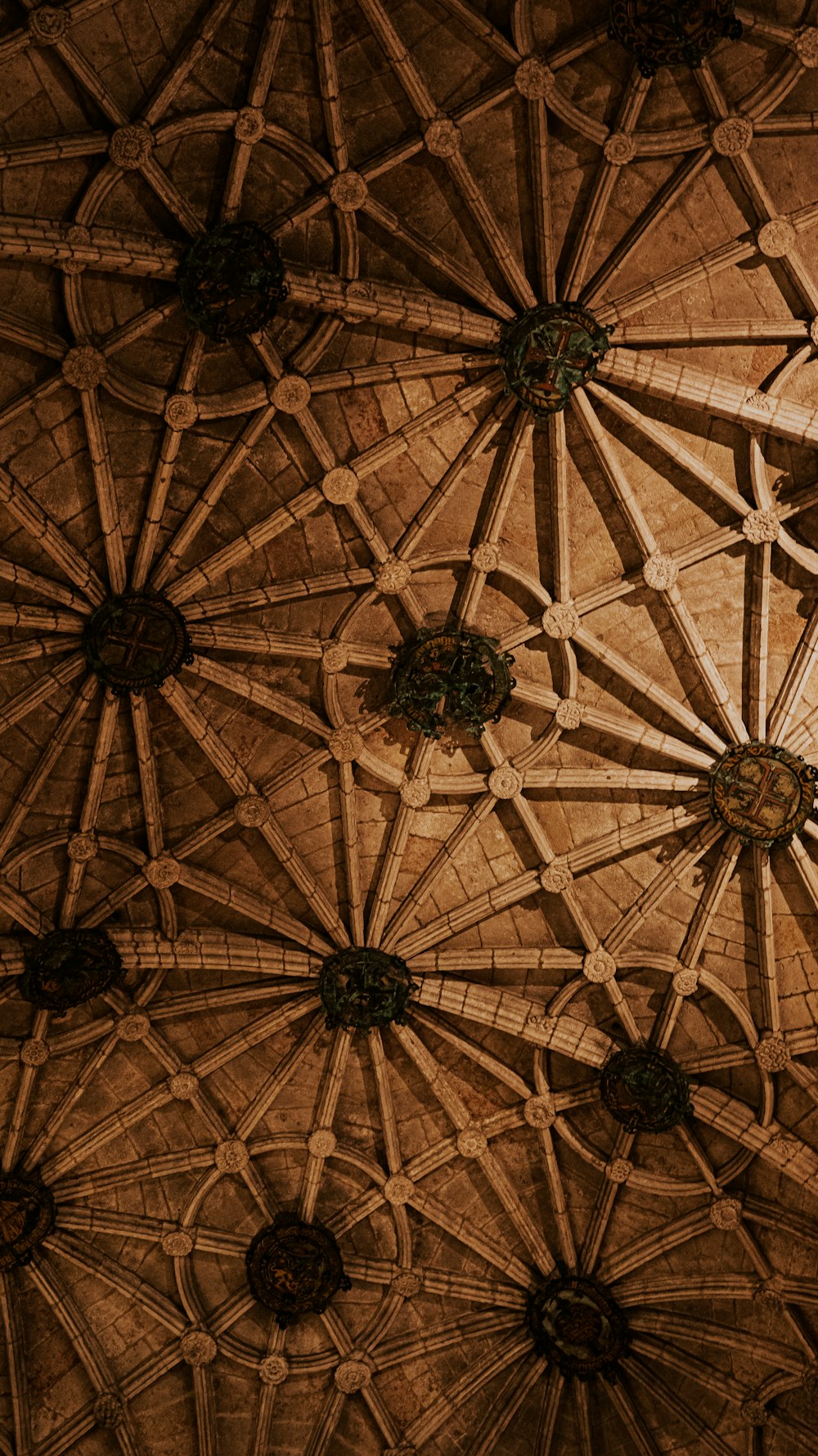 a close up of a ceiling with a clock on it