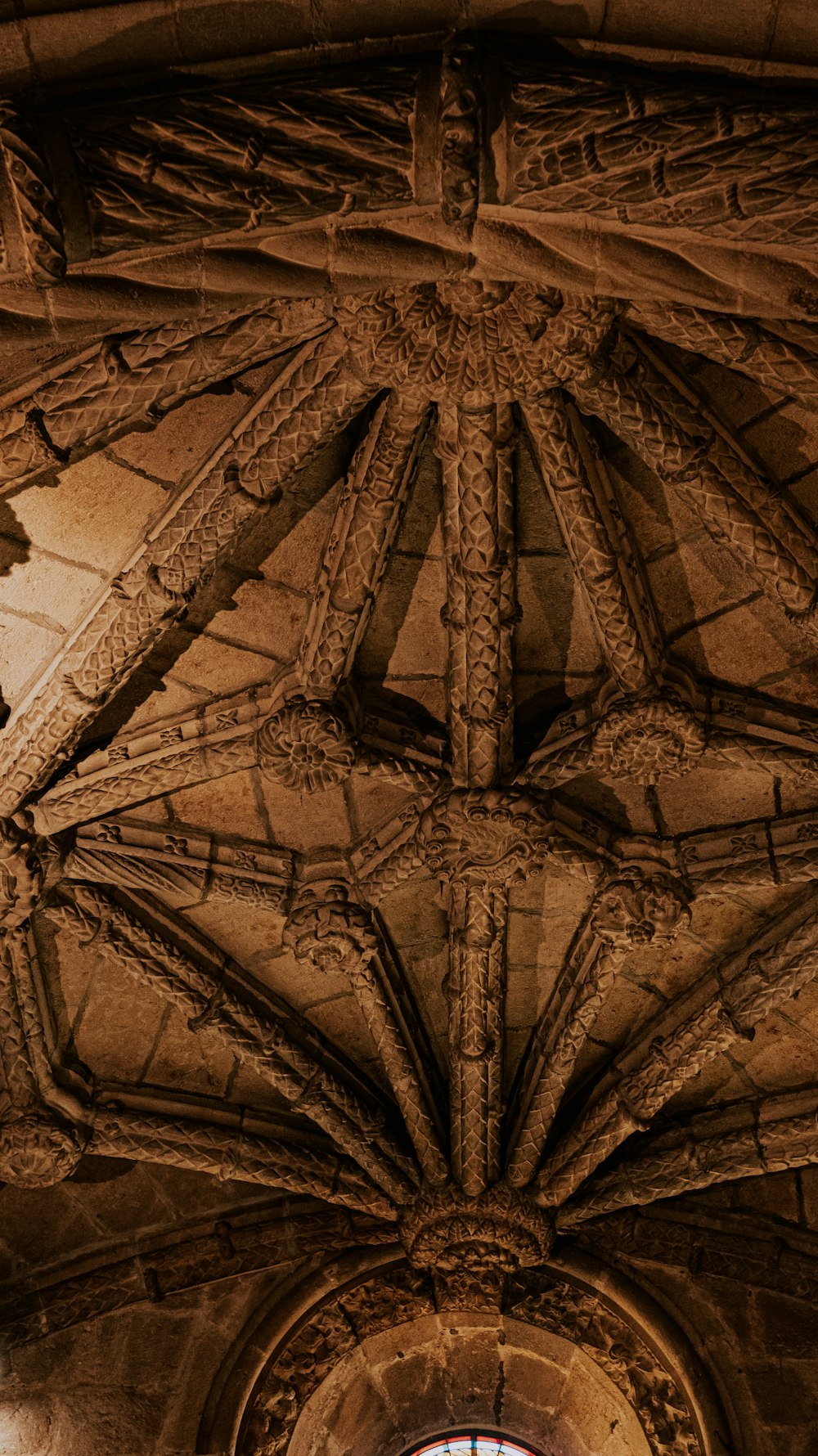 the ceiling of a building with a clock on it