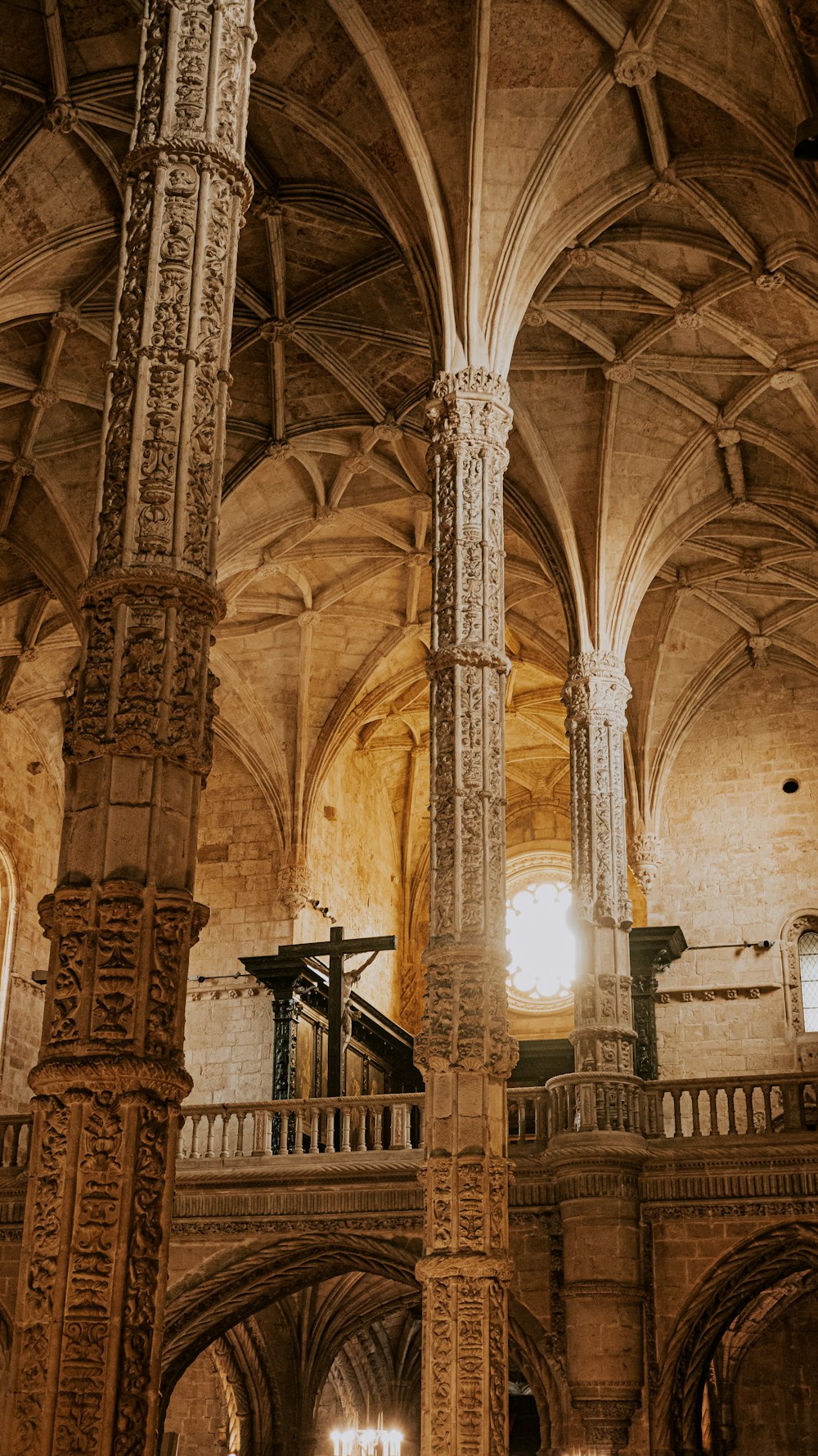 a large cathedral with a cross hanging from the ceiling