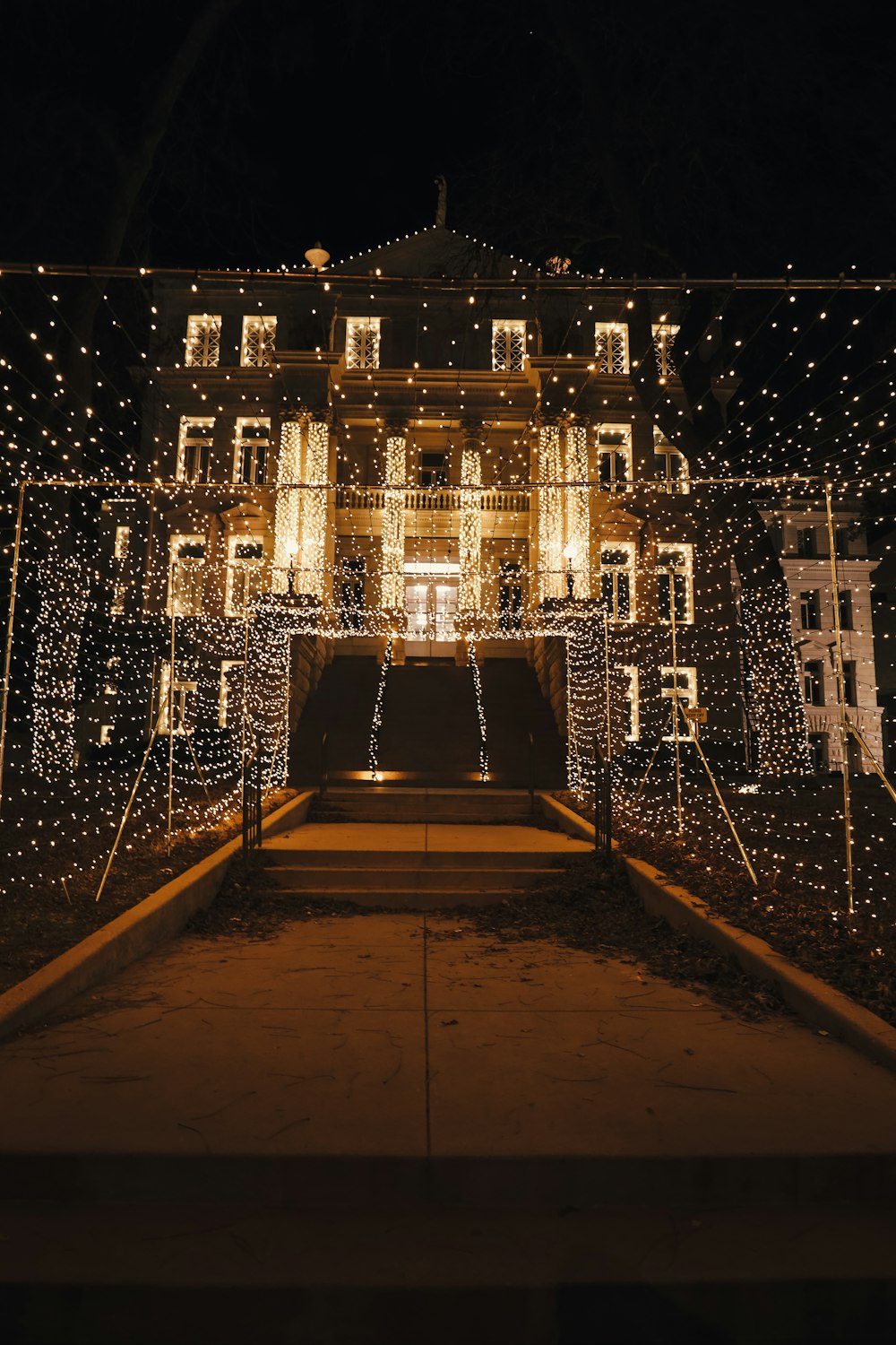 a large building covered in lights at night