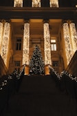 Columns illuminated with bright, festive holiday decorations.