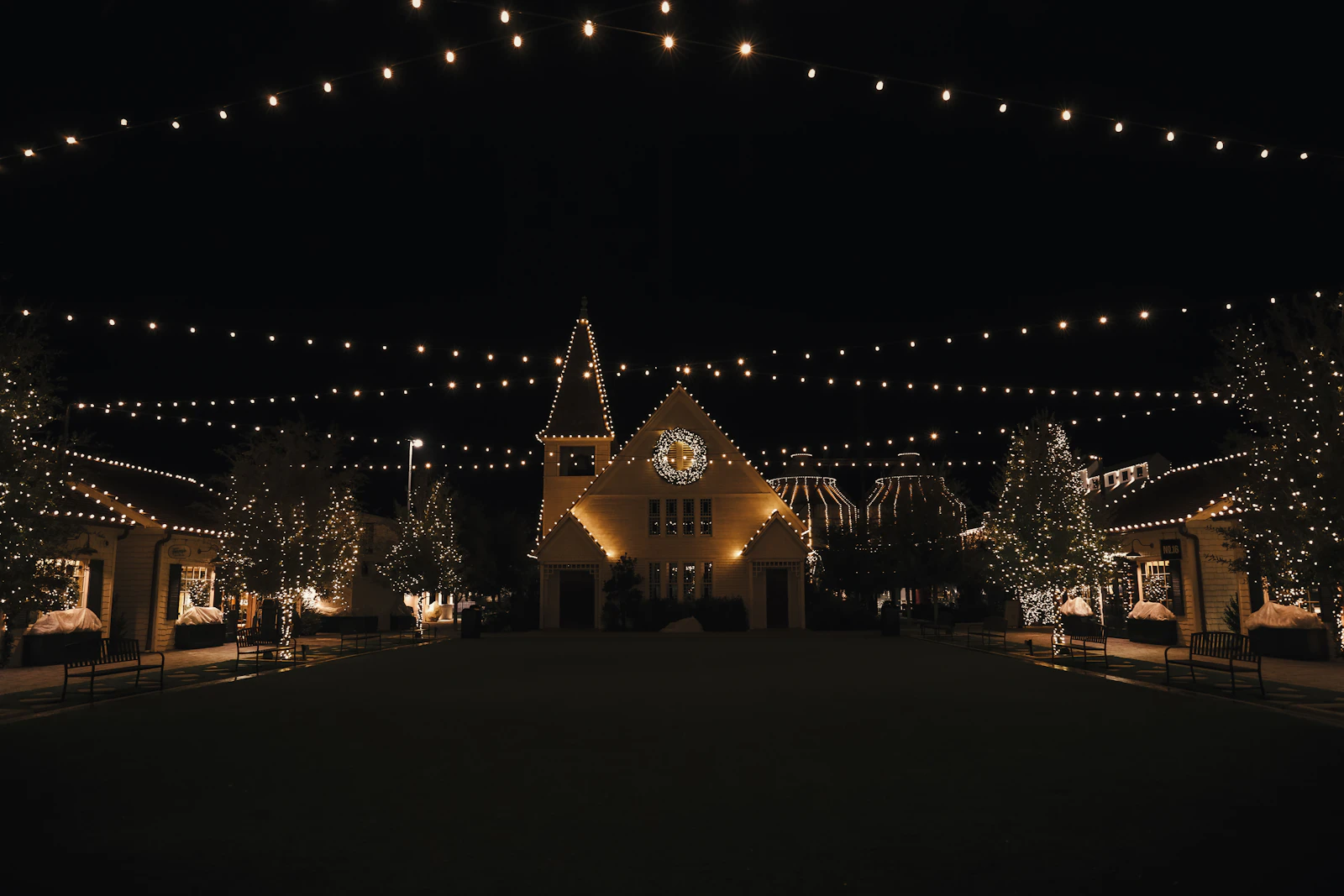 A wedding venue lit up at dusk with the last of the daylight behind it