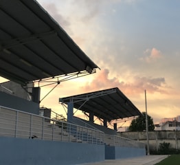 Steel frame stadium structure during sunny day