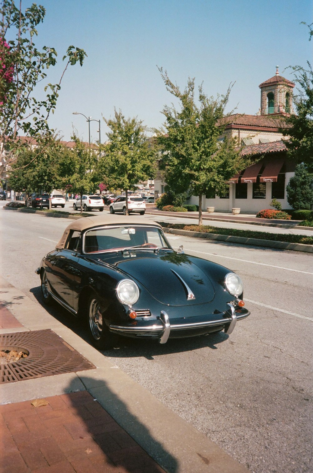 a black car parked on the side of the road