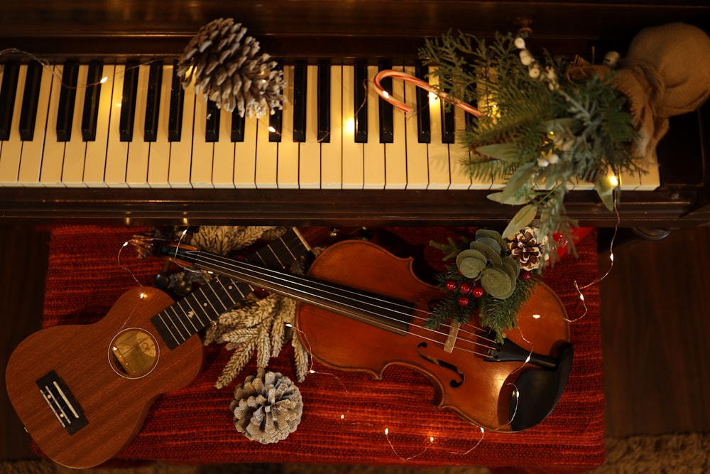 a violin, pine cones, pine cones and a pine cone sit on top of