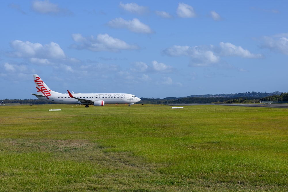 a large jetliner sitting on top of an airport runway