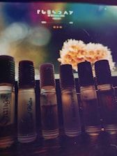 Close-up of vibrant, intricately designed product labels arranged on a wooden table.