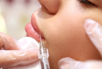 a woman getting a botilage injection from a doctor