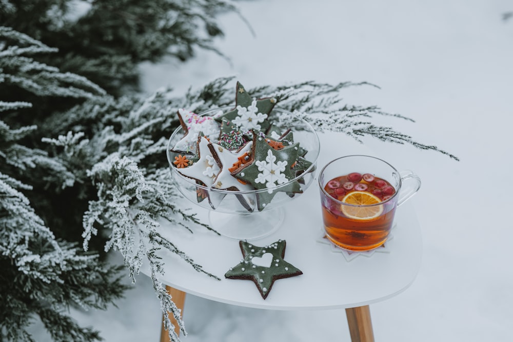 a glass of tea and some cookies on a table