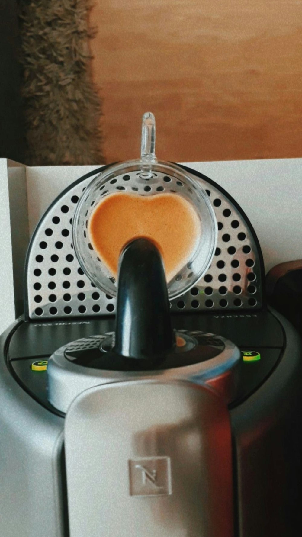a close up of a juicer on a table