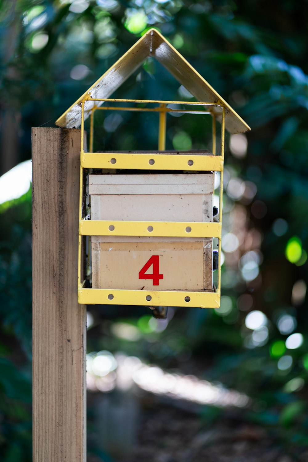 a bird house with a number four on it