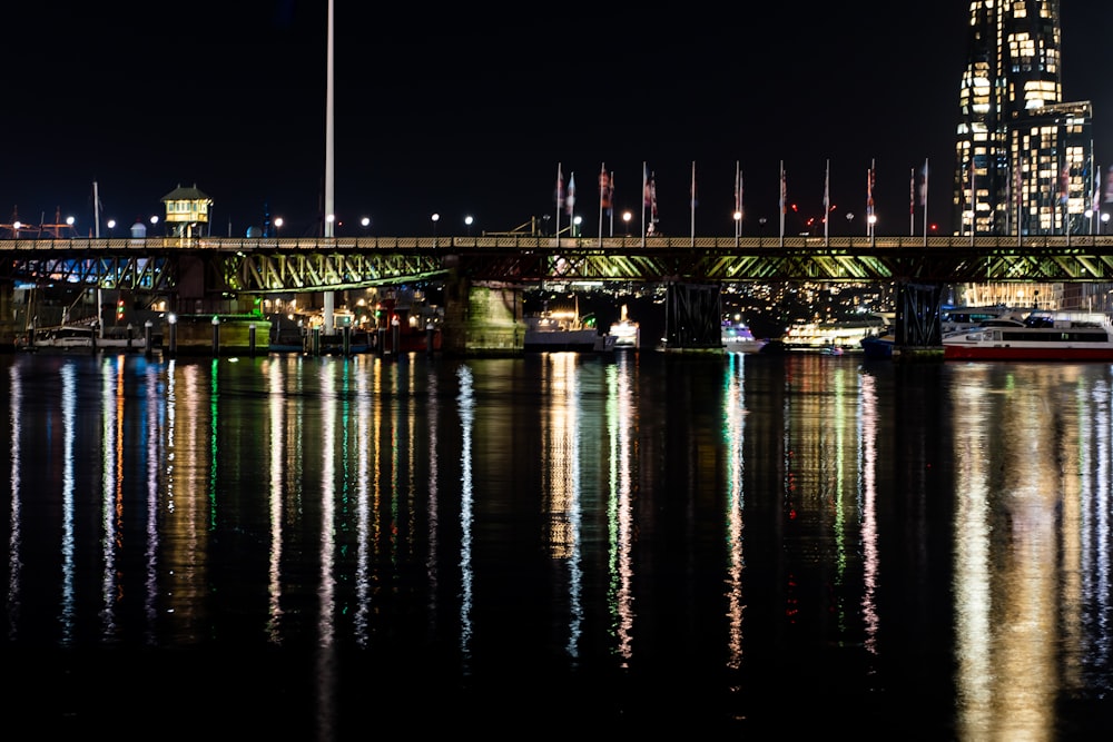 a bridge over a body of water at night