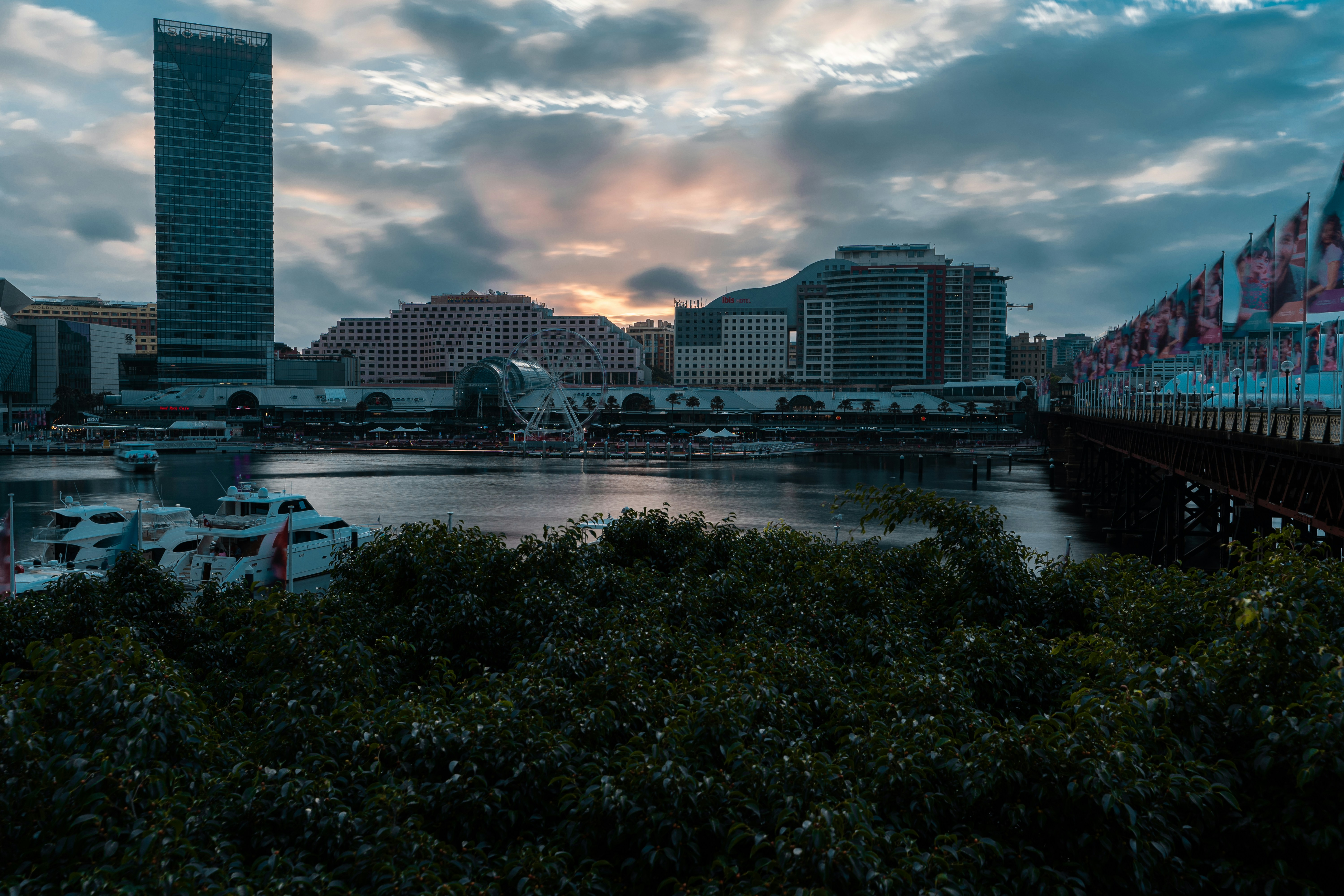 A view of a harbor with boats and buildings in the background photo ...