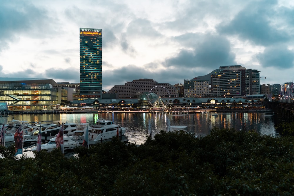 a harbor filled with lots of boats under a cloudy sky