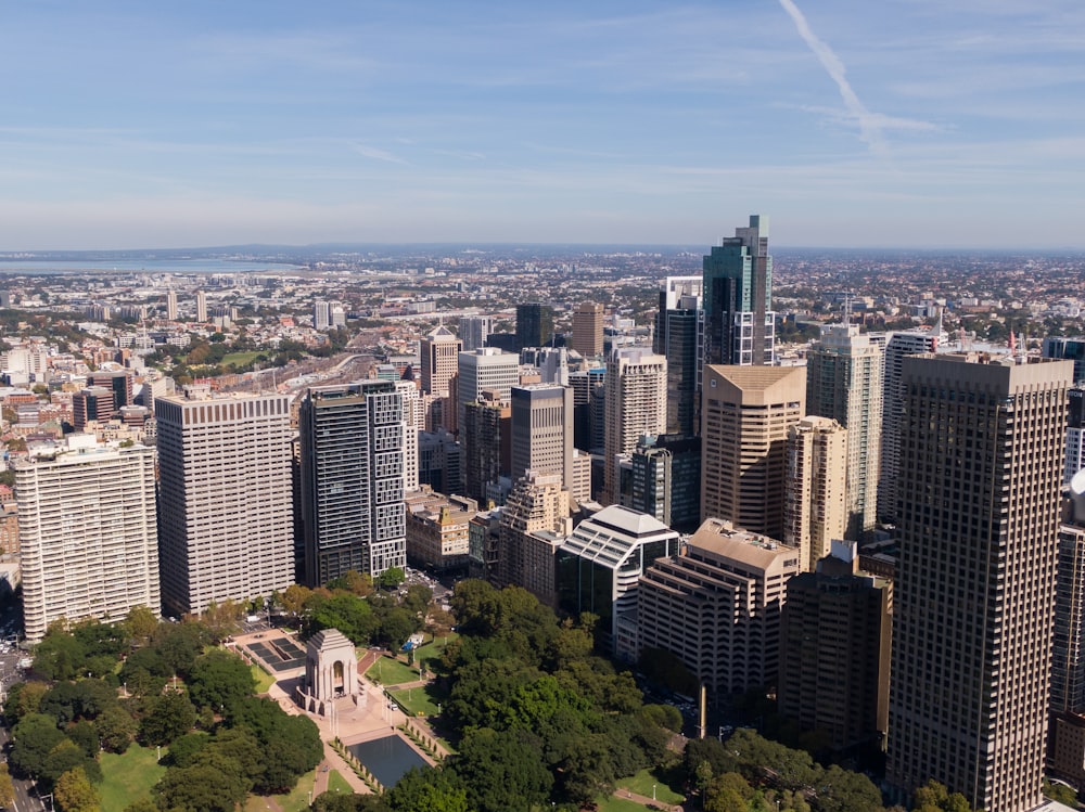 an aerial view of a city with tall buildings